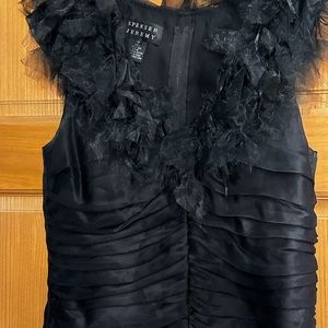 Silk and taffeta blouse .